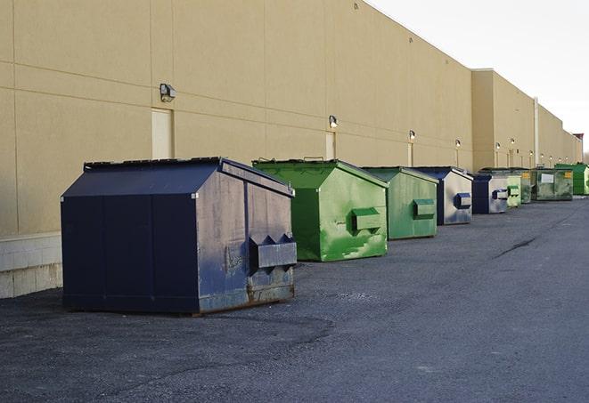 roll-off dumpsters ready for delivery to a construction project in Cutler